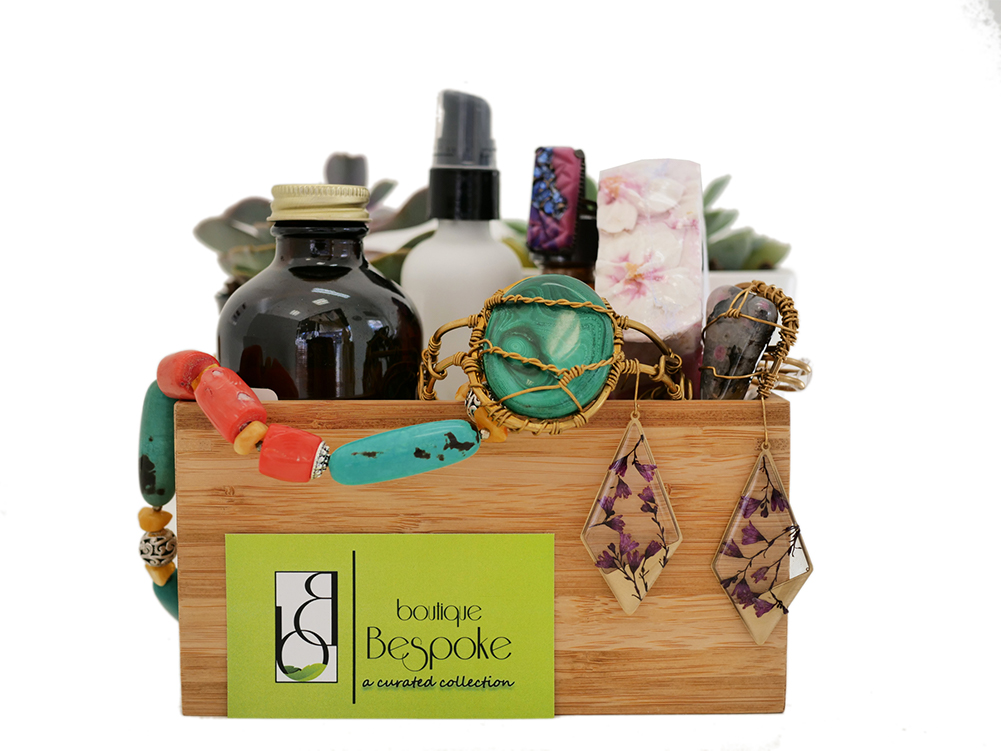 Boutique Bespoke products and jewelry arranged around branded packaging